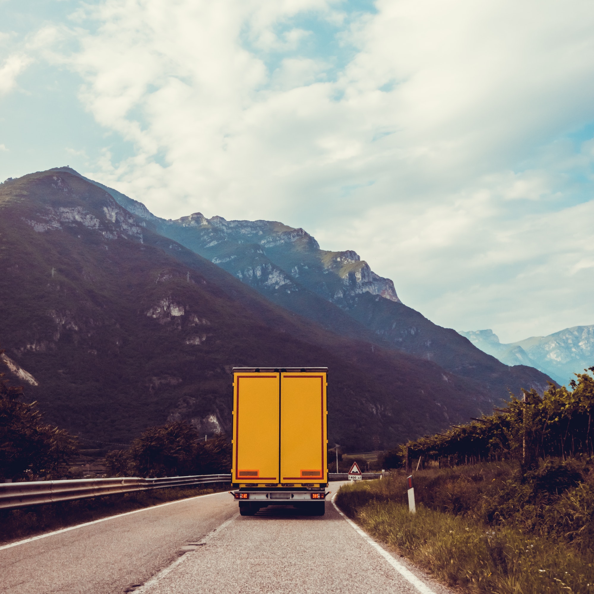 truck on the road. Yellow cargo car